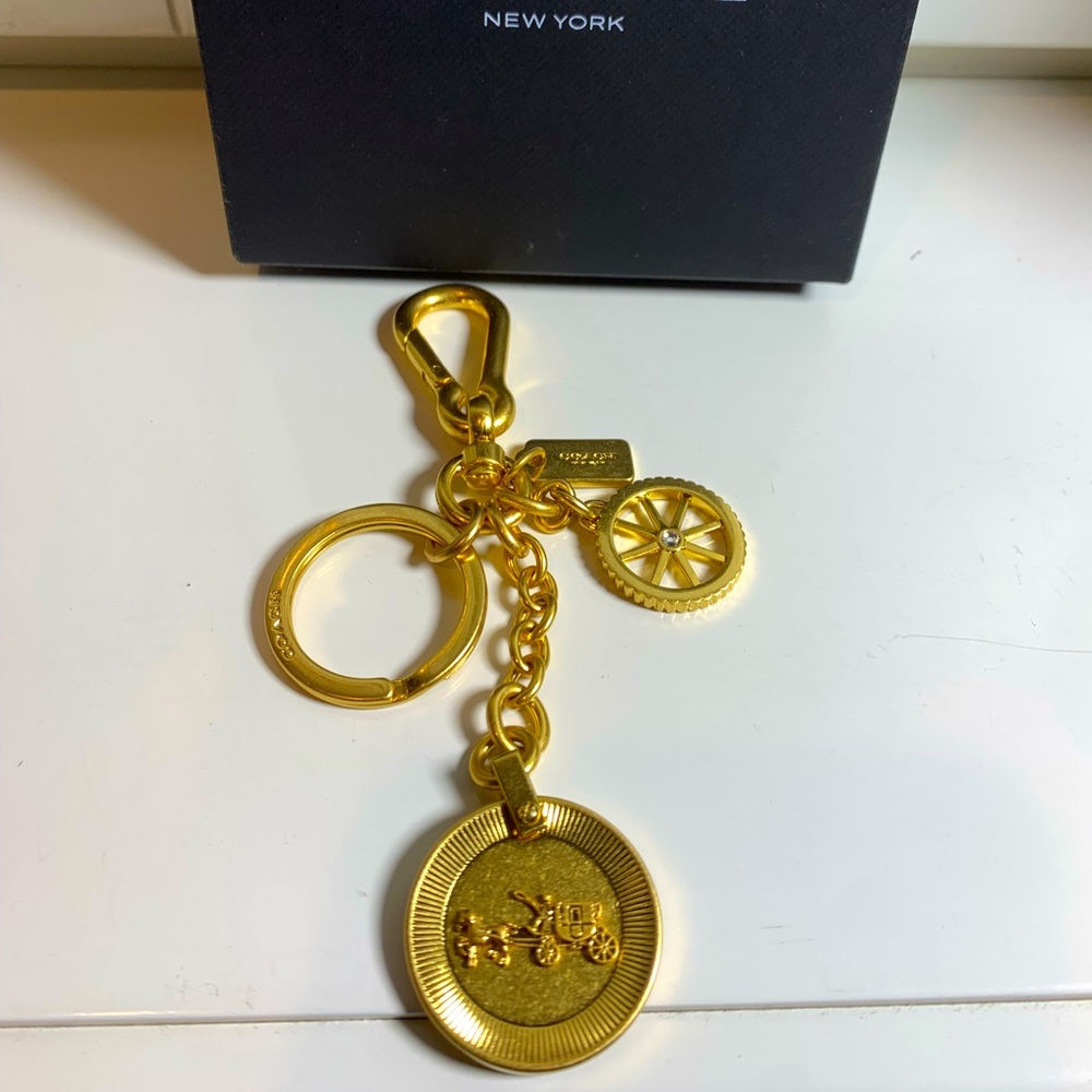 Coach gold charm bag